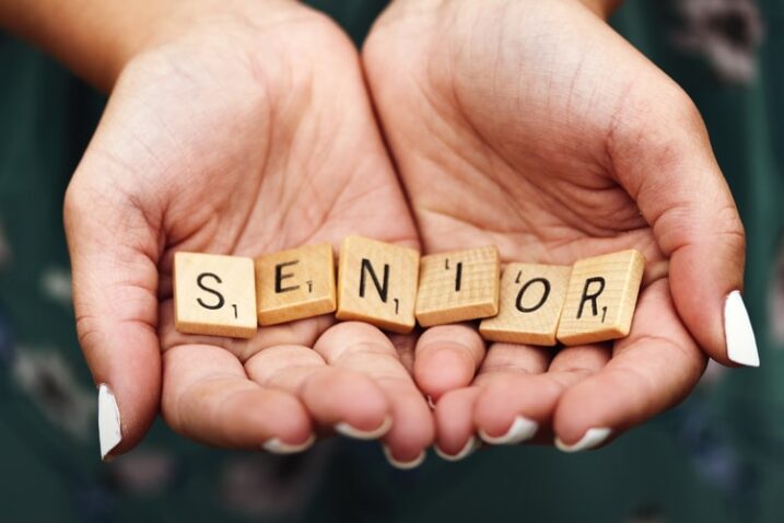 lBlock letters spelling the word, seniors in the palm of hands - Wealthy Affiliate Facts