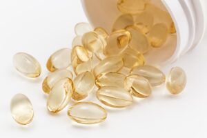 Transparent coated golden vitamin pills