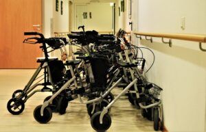 Rollators parked along the wall in a facility