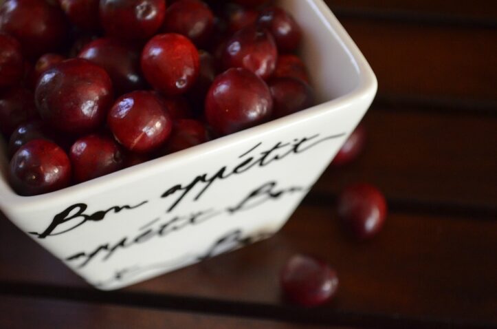Cranberries in a white bowl - Effective Home Remedies for UTI in Adults