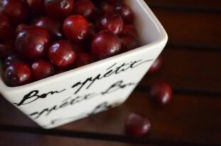 Cranberries in a white bowl - Effective Home Remedies for UTI in Adults