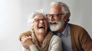 7 Sure Sleep Tips For Older Adults That Work 2 Laughing senior couple wearing glasses cuddling - 7 Sure Sleep Tips for Older Adults that Work