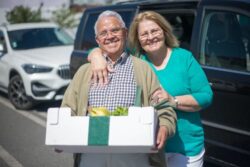 A Senior Couple With the Man Holding a Grocery Box - Disposable Incontinence Underwear