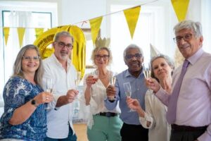 Seniors Raising Glasses for a Toast at a Party - How Safe Are Artificial Sweeteners 
