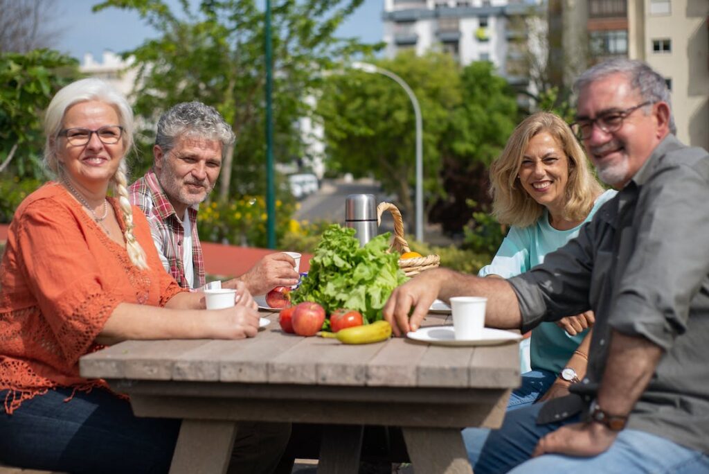 How To Keep The Heart Healthy - Healthy Foods 2 Senior couples at a picnic table - How to Keep the Heart Healthy