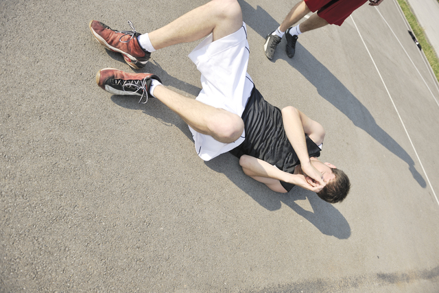 Senior fallen on the ground with hands covering the face - How to Prevent Falls in Seniors