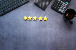 Customer review concept. Rating golden stars on blue background - Wealthy Affiliate