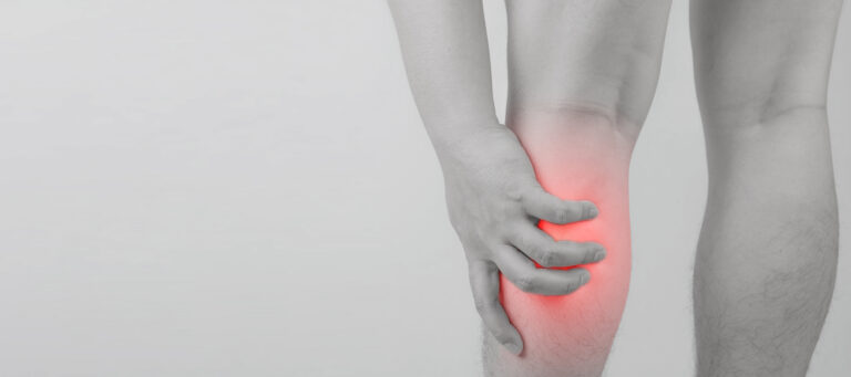 male-hand-holding-calf-pain-area- Reasons for Leg Cramps - Natural Remedies