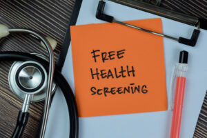 Unlock 5 Recommended Health Screenings for Adults 2 free-health-screening-written-on-sticky-notes-isolated-on-wooden-table - Unlock 5 Recommended Health Screenings for Adults
