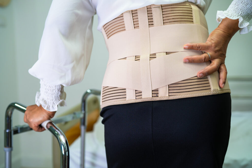 lady-wearing-back-pain-support-belt - 8 Best Back Braces for Lower Back Pain Relief