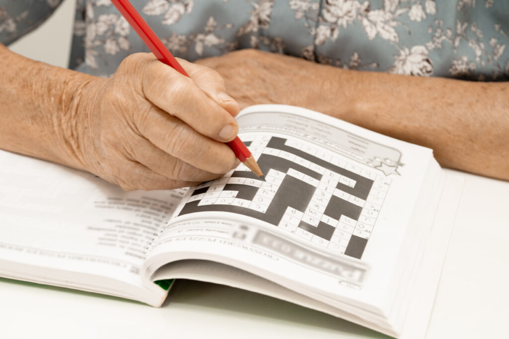 What Causes Memory Loss As You Age? Avoid 9 Triggers 5 memory loss -elderly woman playing sudoku - What Causes Memory Loss as you Age