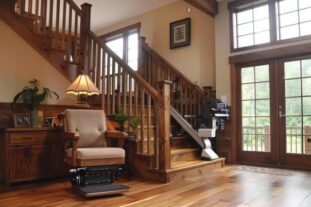 Luxurious wooden home interior showcasing accessibility with a modern stair lift- Aging in Place Home Modifications